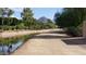 Picturesque view of the canal side walking path with native landscaping at 3201 E Colter St, Phoenix, AZ 85018