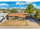Aerial view of house in a neighborhood with a mountain range at 3649 E Delcoa Dr, Phoenix, AZ 85032