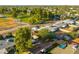 Overhead view of a single-Gathering home in a community with mature trees and a baseball field nearby at 3649 E Delcoa Dr, Phoenix, AZ 85032