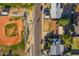 Birds-eye view of neighborhood streets with a baseball field and houses on either side at 3649 E Delcoa Dr, Phoenix, AZ 85032
