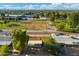 Aerial view of the house in a neighborhood near a baseball field at 3649 E Delcoa Dr, Phoenix, AZ 85032
