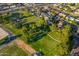 Overhead shot of a community park with lush lawns, mature trees, and sidewalks at 3649 E Delcoa Dr, Phoenix, AZ 85032