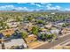 Birds-eye view showcasing a well-established residential neighborhood with tree-lined streets and scenic mountain views at 3649 E Delcoa Dr, Phoenix, AZ 85032