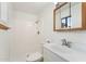 Bathroom featuring a shower, a wood-trimmed mirror and a sink with a vanity at 3649 E Delcoa Dr, Phoenix, AZ 85032