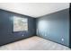 Bedroom with carpeted floor, a window and blue walls at 3649 E Delcoa Dr, Phoenix, AZ 85032