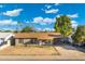 Charming front exterior of home with neutral paint, brown roof, and carport at 3649 E Delcoa Dr, Phoenix, AZ 85032