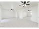 Open living room with arched entryways, tile flooring, and multiple ceiling fans at 3649 E Delcoa Dr, Phoenix, AZ 85032