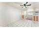 Bright open space with tile flooring, ceiling fan, and living area access, perfect for gatherings and everyday living at 3649 E Delcoa Dr, Phoenix, AZ 85032