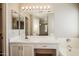 Bright bathroom with white vanity, large mirror, and bathtub with tile surround at 3750 S Conestoga Rd, Apache Junction, AZ 85119