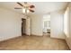 Bedroom featuring tile flooring, neutral walls, and view into the bathroom at 3750 S Conestoga Rd, Apache Junction, AZ 85119