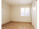 Clean bedroom showcasing tile flooring, plantation shutters, and a closet at 3750 S Conestoga Rd, Apache Junction, AZ 85119