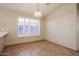 Dining room featuring tile flooring, window with blinds, and chandelier lighting at 3750 S Conestoga Rd, Apache Junction, AZ 85119