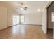 The living room features tile flooring, a ceiling fan, and doors to the backyard at 3750 S Conestoga Rd, Apache Junction, AZ 85119