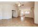 The living room features tile flooring, a ceiling fan, and open access to the kitchen at 3750 S Conestoga Rd, Apache Junction, AZ 85119