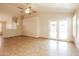 The living room features tile flooring, a ceiling fan, and doors to the backyard at 3750 S Conestoga Rd, Apache Junction, AZ 85119
