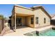 Backyard pool with covered patio and desert landscaping, perfect for outdoor relaxation at 3750 S Conestoga Rd, Apache Junction, AZ 85119