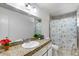 Modest bathroom featuring a shower/tub combo, granite countertop, and a single-sink vanity at 3807 N 56Th Dr, Phoenix, AZ 85031