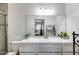 Clean bathroom featuring a shower, toilet, and large mirror with an updated vanity at 3807 N 56Th Dr, Phoenix, AZ 85031