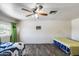 Large bedroom with hardwood flooring, and two twin beds at 3807 N 56Th Dr, Phoenix, AZ 85031