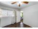 Cozy bedroom with hardwood floors, a window, and neutral paint at 3807 N 56Th Dr, Phoenix, AZ 85031