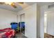 Bedroom featuring mirrored closet doors and wood floors at 3807 N 56Th Dr, Phoenix, AZ 85031