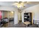 Inviting bedroom with a mirrored closet and a modern ceiling fan at 3807 N 56Th Dr, Phoenix, AZ 85031