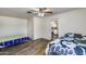 This bedroom has hardwood floors, ceiling fan and ensuite kitchen at 3807 N 56Th Dr, Phoenix, AZ 85031
