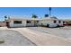 Beautiful home with a long driveway, lush landscaping, and a freshly painted exterior at 3807 N 56Th Dr, Phoenix, AZ 85031