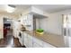 Spacious kitchen island with stone countertop and white cabinets at 3807 N 56Th Dr, Phoenix, AZ 85031