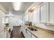 Bright kitchen with a double sink and white cabinetry at 3807 N 56Th Dr, Phoenix, AZ 85031