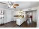 Spacious eat-in kitchen boasts granite countertops, a ceiling fan, and modern appliances, great for cooking at 3807 N 56Th Dr, Phoenix, AZ 85031