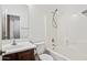 Bathroom features a white vanity, a tub/shower combination, and neutral tile at 3850 E Geronimo St, Gilbert, AZ 85295