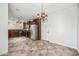 Open-concept kitchen and dining area with stainless steel appliances and modern lighting at 3850 E Geronimo St, Gilbert, AZ 85295