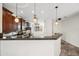 Stylish kitchen with granite countertops, a breakfast bar, and modern pendant lighting at 3850 E Geronimo St, Gilbert, AZ 85295