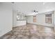 Spacious living room showcasing an open layout, tile flooring, and a ceiling fan at 3850 E Geronimo St, Gilbert, AZ 85295