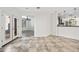 Living room with tiled floors, double doors leading to the exterior, and open access to other rooms at 3850 E Geronimo St, Gilbert, AZ 85295