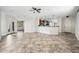 Expansive living room with tile flooring, natural light, and a seamless flow into the kitchen at 3850 E Geronimo St, Gilbert, AZ 85295