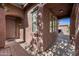 Covered front porch, offering a sheltered entrance with views of the neighborhood at 3850 E Geronimo St, Gilbert, AZ 85295