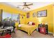 This bedroom is adorned with a football theme, ideal for sports enthusiasts at 4331 E Redwood Ln, Phoenix, AZ 85048