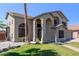 This two-story home features desert landscaping, palm trees, stucco exterior and a beautiful entry at 4331 E Redwood Ln, Phoenix, AZ 85048