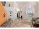Bright, open foyer featuring tile floors, high ceilings, decorative accents, and plenty of natural light at 4331 E Redwood Ln, Phoenix, AZ 85048