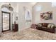 Bright entry foyer with tile flooring, vaulted ceilings, an iron door, and large windows at 4331 E Redwood Ln, Phoenix, AZ 85048