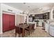 The kitchen features stainless steel appliances, a center island, and dining table with chairs at 4331 E Redwood Ln, Phoenix, AZ 85048