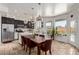 Bright kitchen with stainless steel appliances, large windows, and an island dining area at 4331 E Redwood Ln, Phoenix, AZ 85048