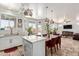 The open concept kitchen and dining area features pendant lights and multiple large windows at 4331 E Redwood Ln, Phoenix, AZ 85048