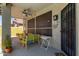 Covered patio featuring a ceiling fan, privacy screens, and cozy seating with a ceiling fan at 4331 E Redwood Ln, Phoenix, AZ 85048