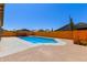 Large backyard featuring a pool, patio, and desert landscaping for a private retreat at 4331 E Redwood Ln, Phoenix, AZ 85048