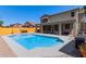 Spacious backyard with a sparkling pool and covered patio, perfect for outdoor living at 4331 E Redwood Ln, Phoenix, AZ 85048