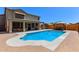 Backyard oasis with a sparkling blue pool, patio seating, and a covered lounge area at 4331 E Redwood Ln, Phoenix, AZ 85048