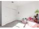 Bright bedroom with a ceiling fan, spacious closet and a playful decor, perfect for a  at 4562 S Park Grove St # 101, Gilbert, AZ 85297